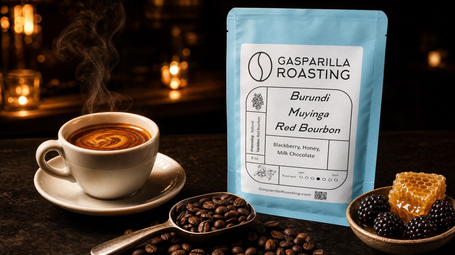 A steaming cup beside a bag of Gasparilla Roasting Burundi Muyinga Red Bourbon, with a scoop of beans, blackberries, and honeycomb